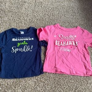 Two toddler girl Seahawks shirts